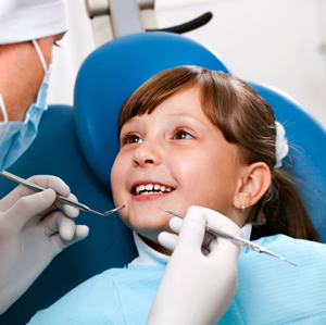 Child Getting Her Teeth Examined